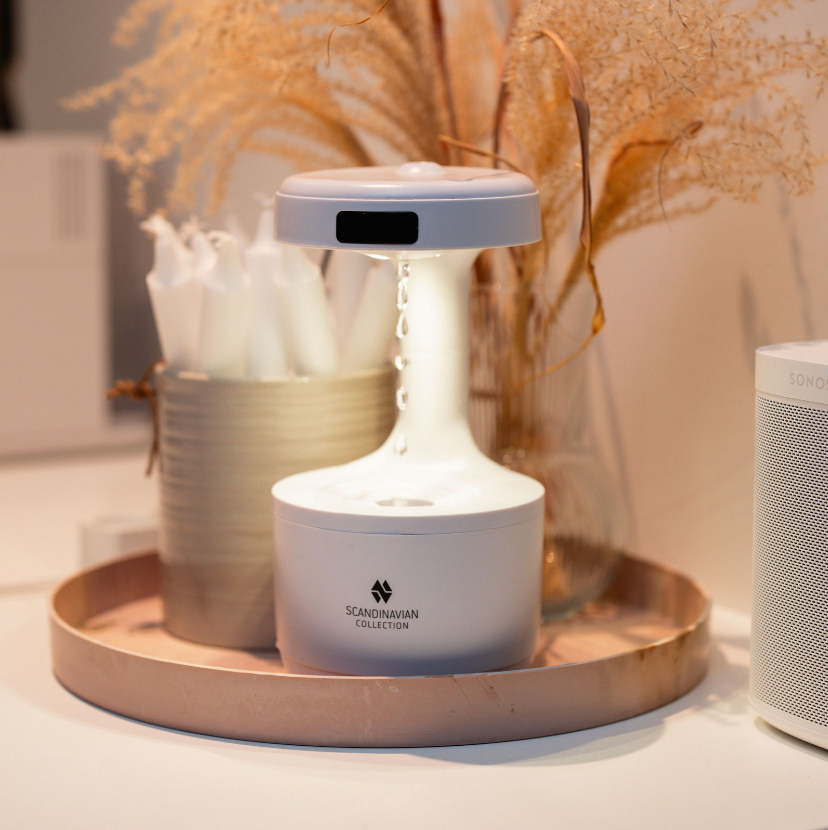 Luftfugter med anti-tyngdekraft effekt med vanddråber og ur