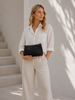 Clutch med perforeret mønster - black
