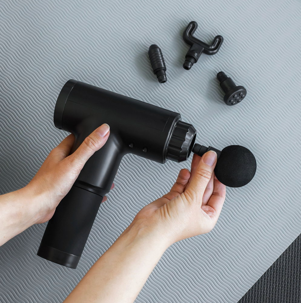 Massagepistol med 4 hoveder