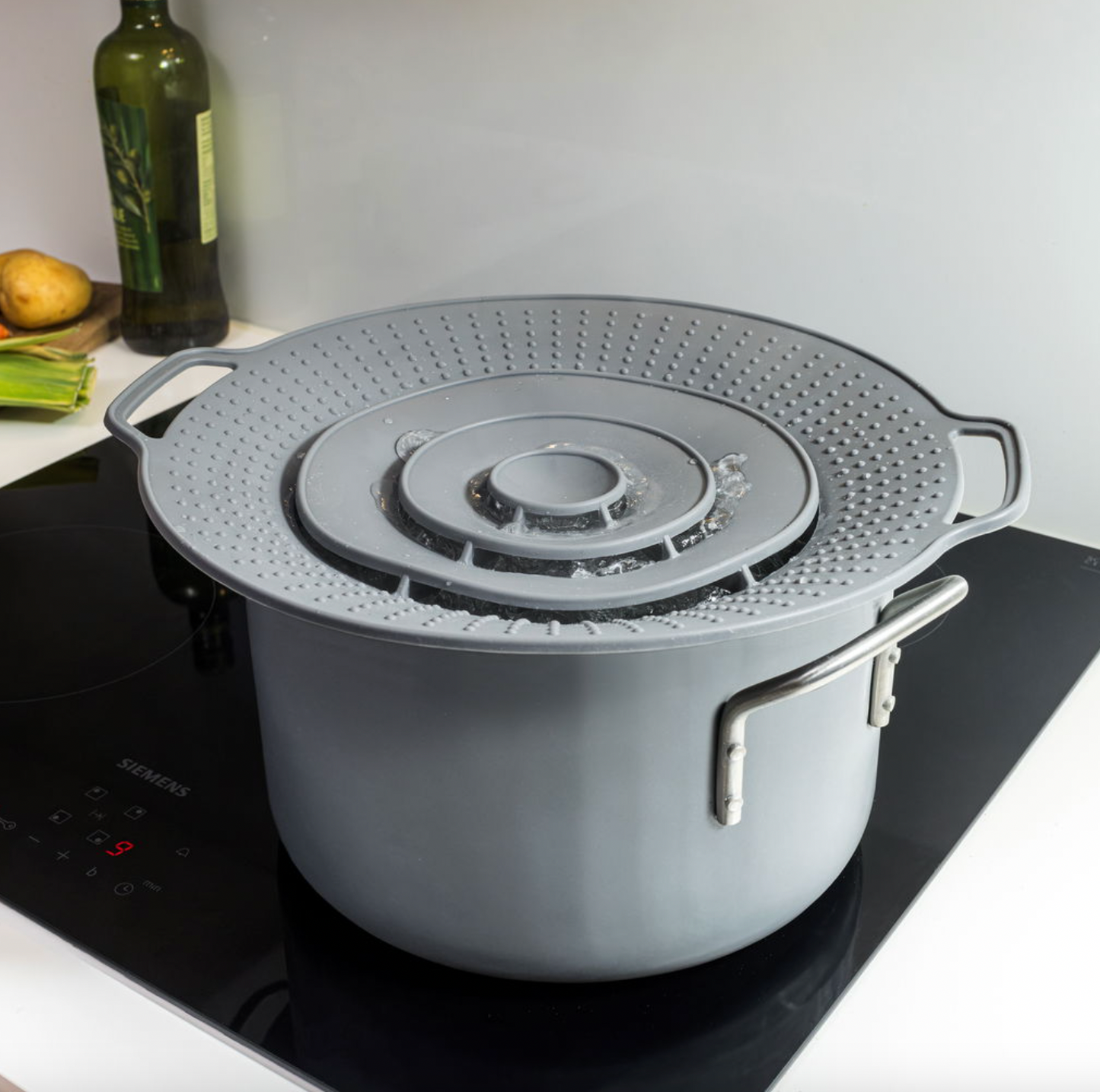 Grydelåg med overkogningssikring