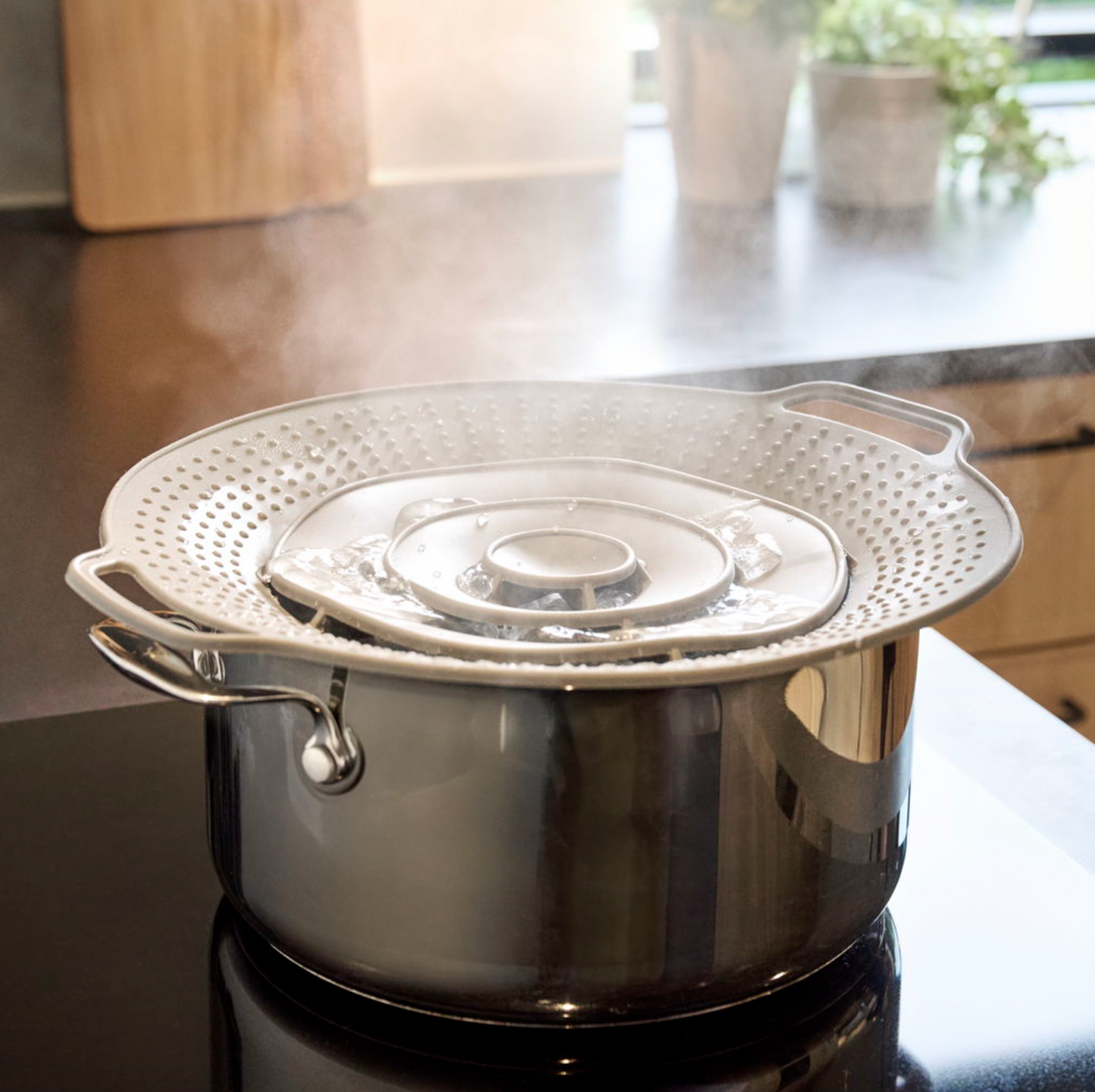 Grydelåg med overkogningssikring