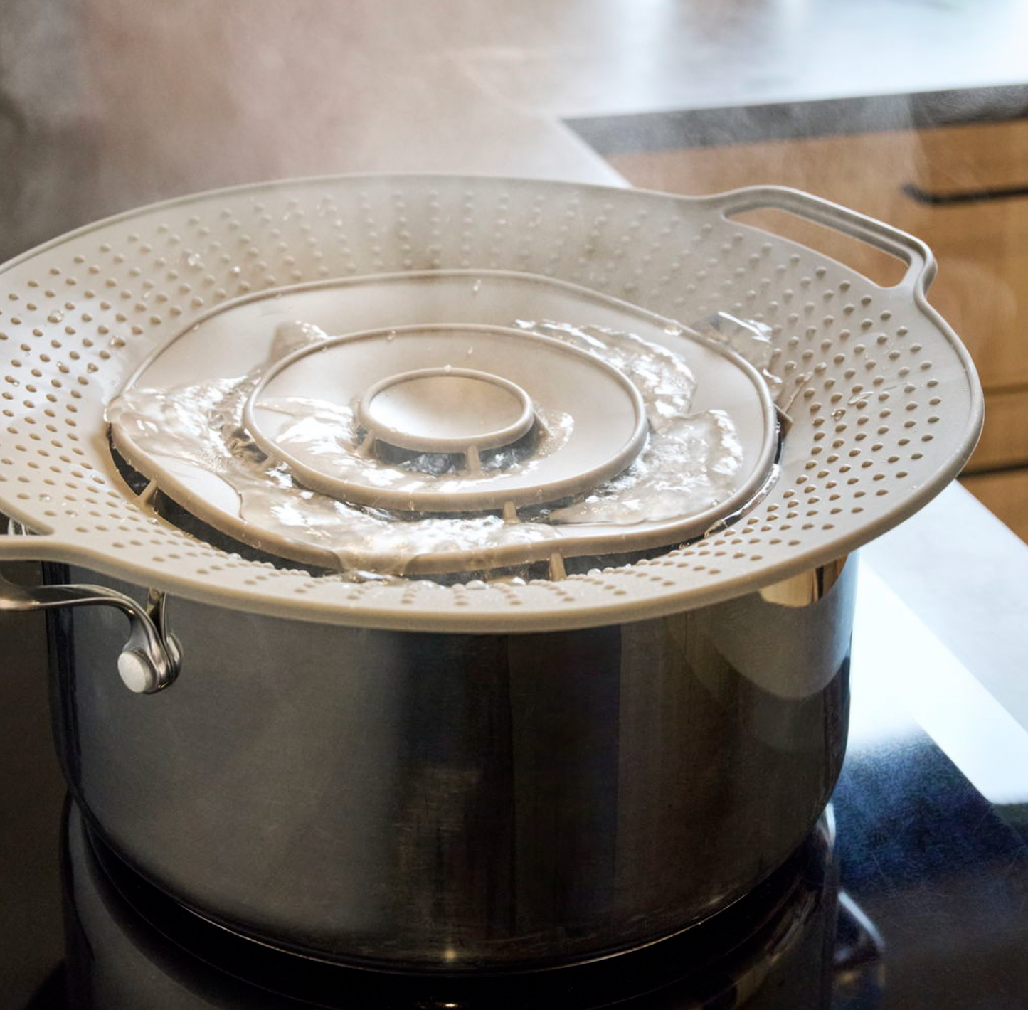 Grydelåg med overkogningssikring