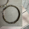 Armbånd Nikki pyrit Onyx - Forgyldt Sterling silver kors