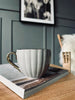 Tekop med guld hank – Beige